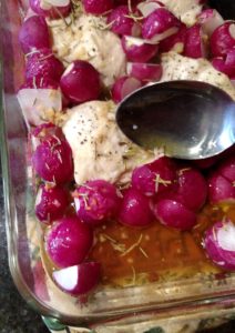 basting Low Carb Rosemary Chicken and Radishes